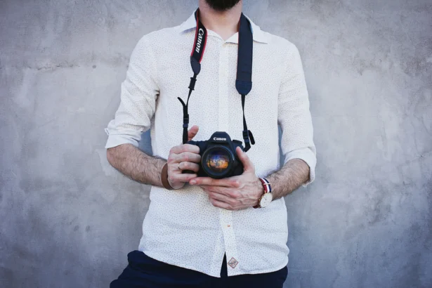 Wedding photographer holding up a camera