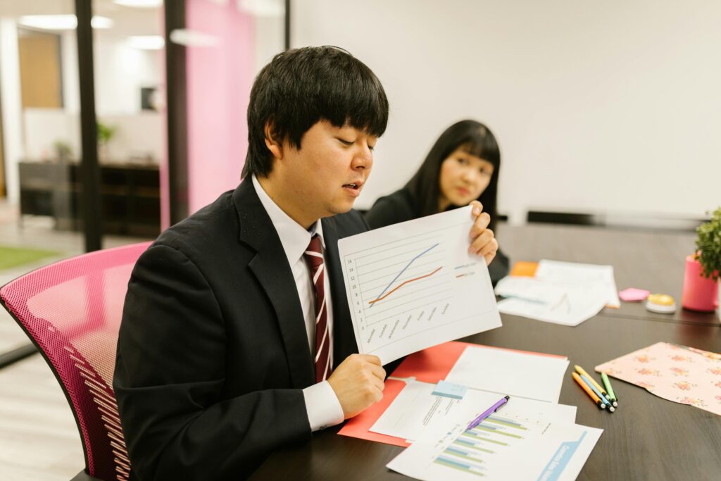 Two People Having a Meeting in the Office